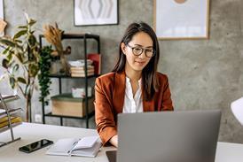 Business woman works on a laptop